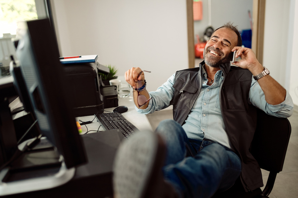 business-owner-at-ease-feet-up-office-huskimarketing.com
